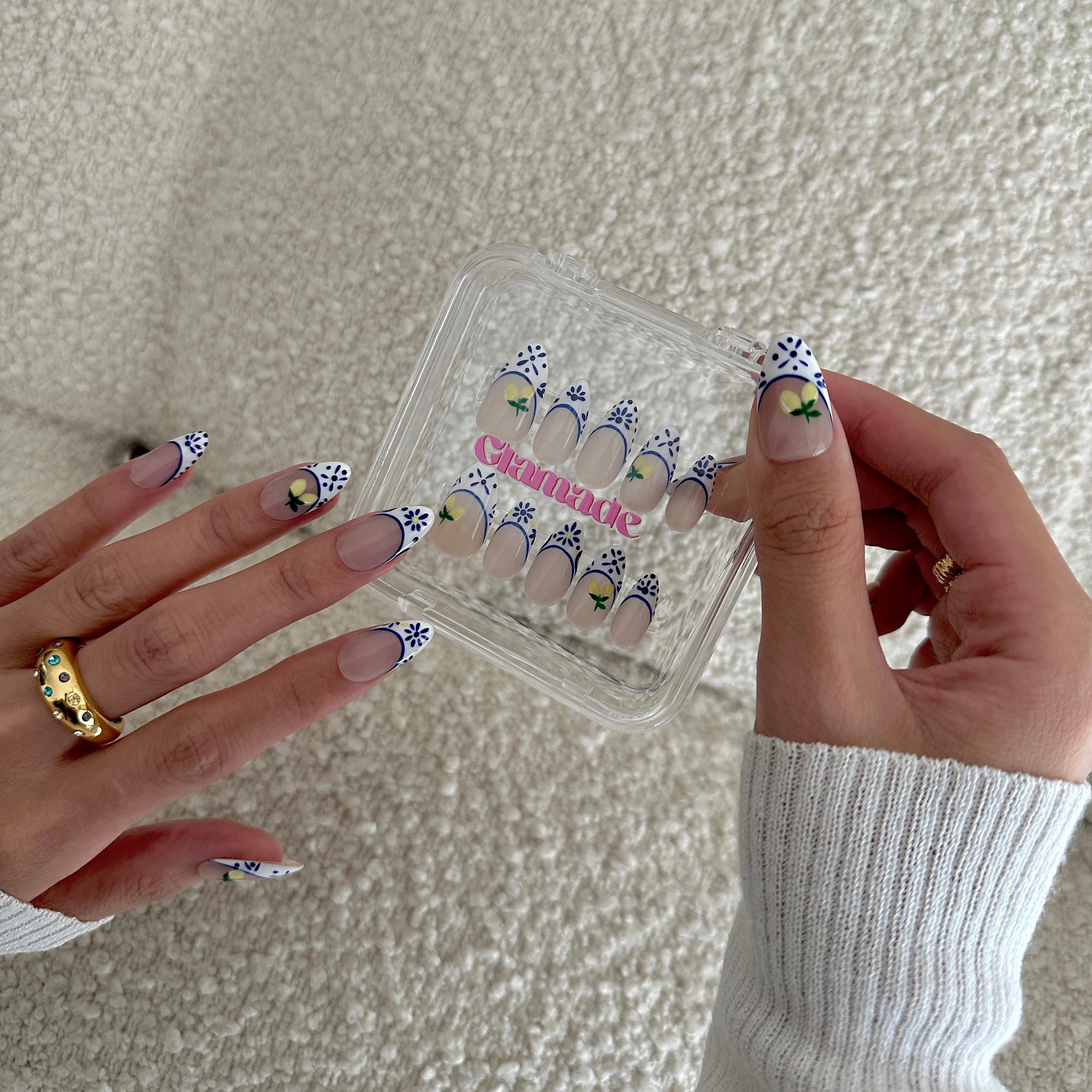 Model wearing Glamade luxury press-on nails, short almond shape