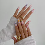 Model wearing Glamade luxury press-on nails, almond shape
