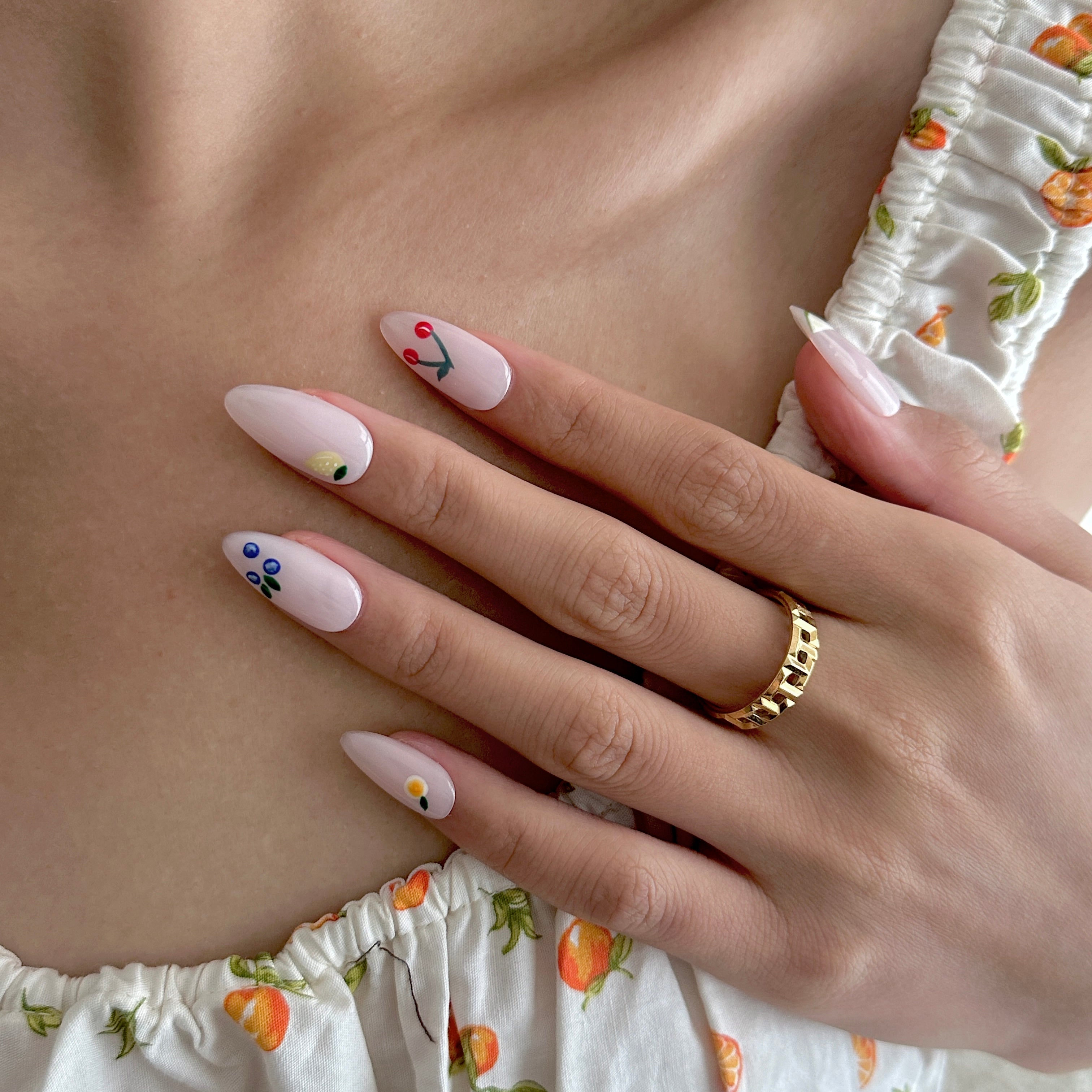 Model wearing Glamade luxury press-on nails, almond shape
