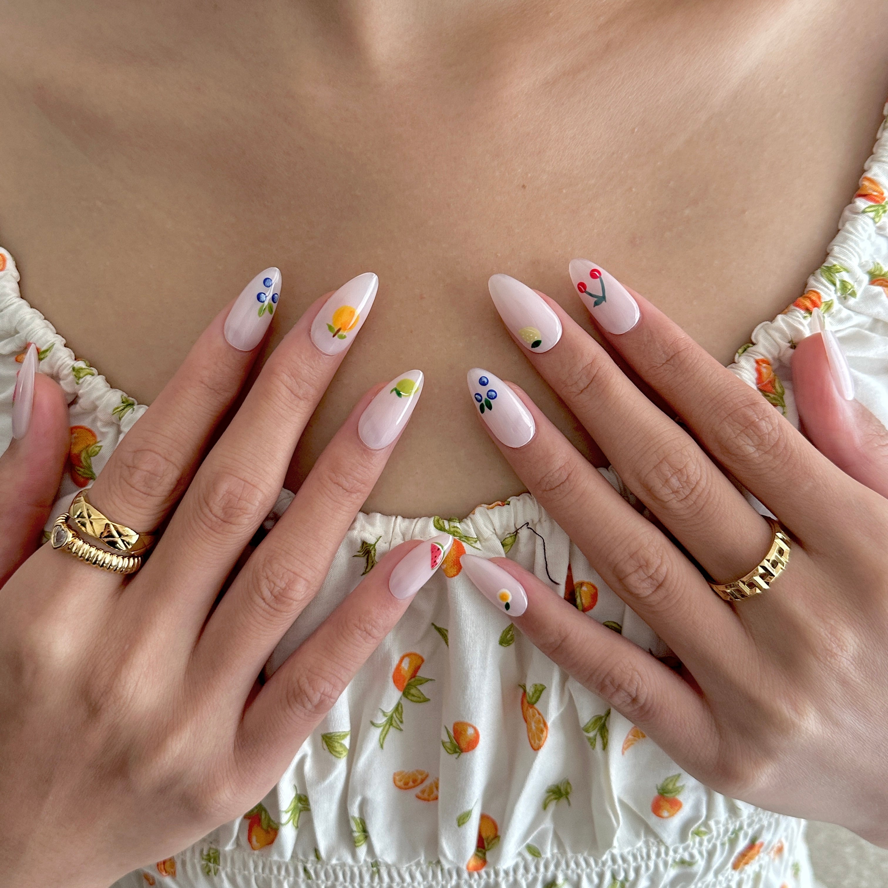 Model wearing Glamade luxury press-on nails, almond shape