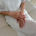 Model wearing Glamade luxury press-on nails, short almond shape