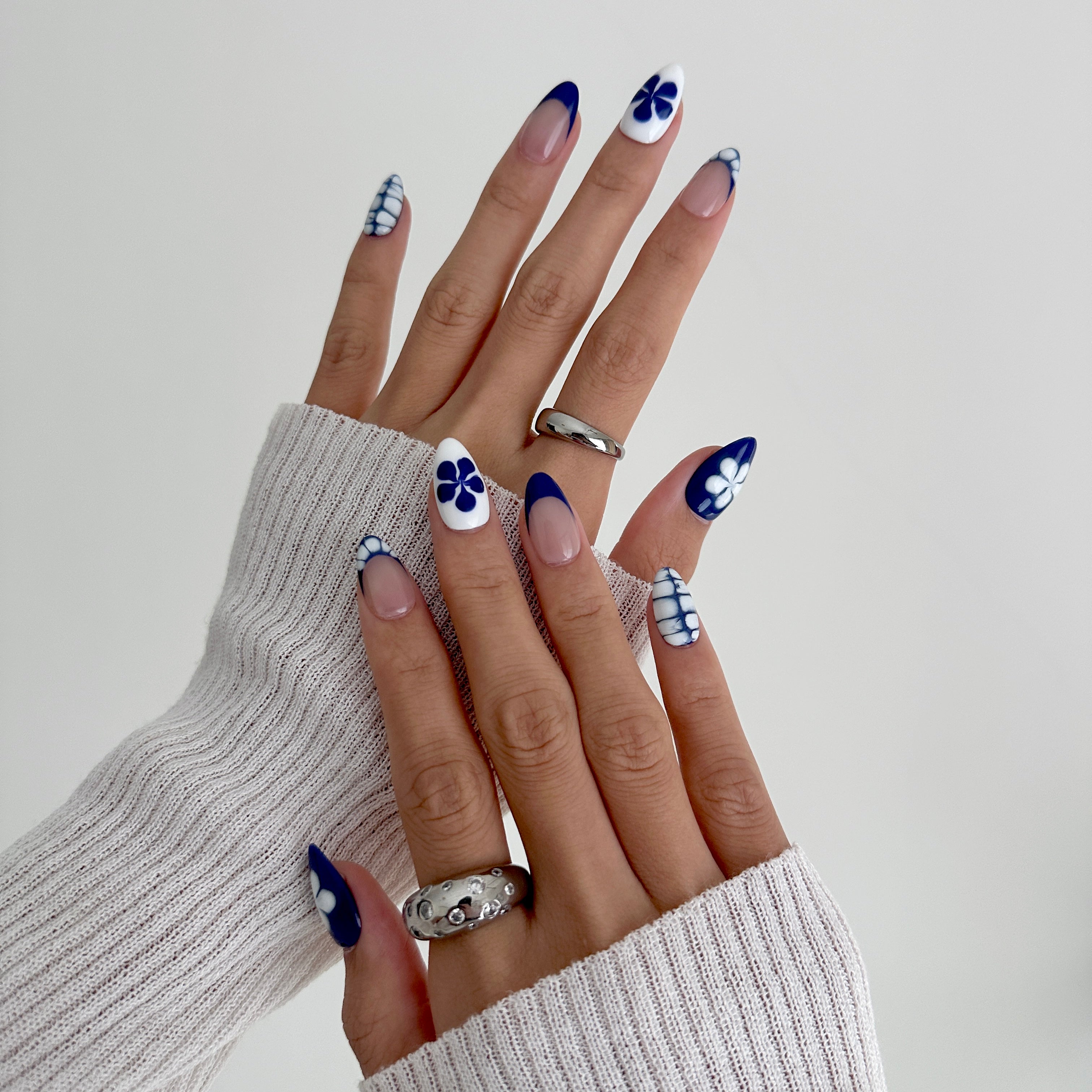 Model wearing Glamade luxury press-on nails, short almond shape